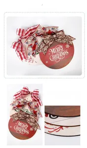 Detailed view of round wooden Christmas door signs with festive bows and Merry Christmas print