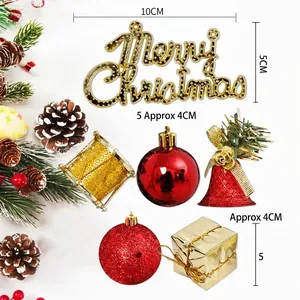 Christmas tree decoration set with Merry Christmas sign, red bells and golden drums