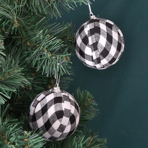7cm black and white buffalo plaid Christmas ball ornaments hanging on a green Xmas tree