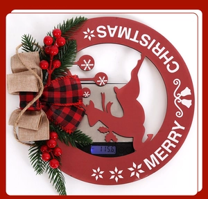 Weight measurement of red wooden Christmas wreath with berries and deer cutout on scale
