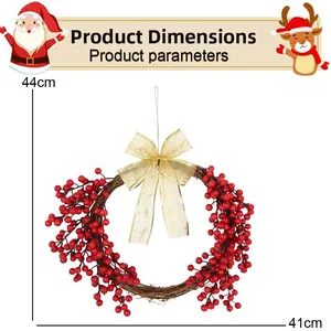 Detail view of 41cm Christmas wreath with red berries, brown vine, and golden bow