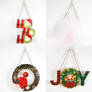 Detail of four Christmas wooden signs with Santa, Snowman and festive holiday greetings