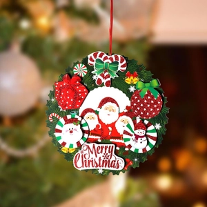 Detail of 3D paper Christmas wreath with Santa Claus, snowman and Merry Christmas text