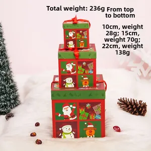 Set di scatole regalo di Natale impilate con fiocchi di seta e motivi festivi