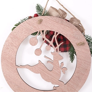 Christmas hollow wood door sign with reindeer design, pine needles and red berries bow