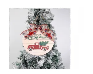 Close-up of a wooden Christmas door sign with a red truck and Merry Christmas text