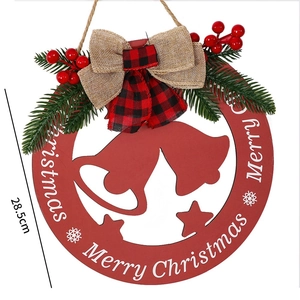 Hollow wooden Merry Christmas door sign with red berries and burlap bow decoration