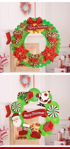 Detail of 3D paper Christmas garlands featuring Santa, gingerbread man and festive bells