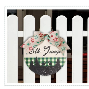 Round wooden Christmas door sign with Elk Jungle print and festive burlap bow