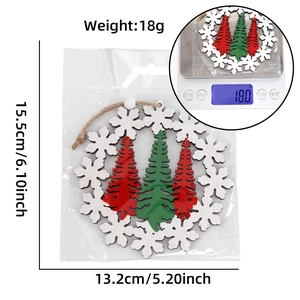 Detail of wooden Christmas ornament featuring laser-cut snowflake and pine tree design