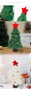 Close-up of wool felt mini Christmas trees with gold bells and star on wooden base