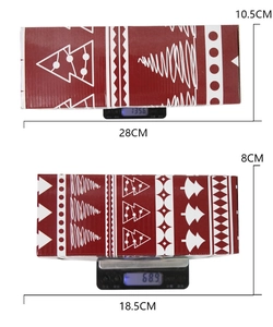 Detailed view of red Christmas gift boxes with tree patterns showing size and weight specs