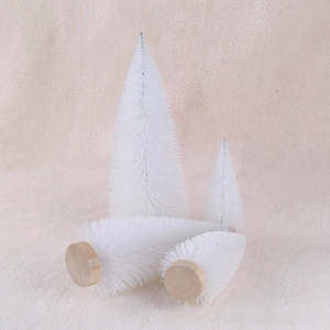 Set of four mini white pine needle Christmas trees with natural wood bases for table decor