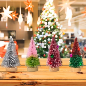 Miniature set of four frosted Christmas trees with wooden bases for festive tabletop decor