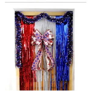 Detailed view of July 4th tinsel curtains with a rustic Independence Day bow decoration