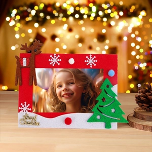 Close-up of red felt Christmas photo frame with reindeer and Merry Christmas lettering