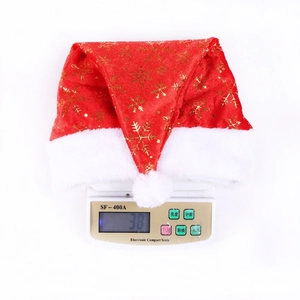 Detailed top view of a festive red Christmas hat being weighed on a digital scale