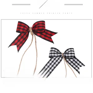 Detail of red and black buffalo plaid ribbon bows with natural jute twine center decoration