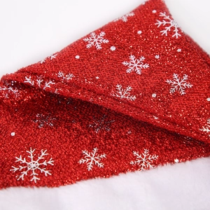 Red sequin Christmas hat with snowflake prints and white faux fur trim for festive holiday decor