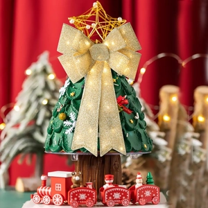 LED lighted Christmas tree table ornament with red train and golden bow decoration