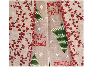 Detail of linen Christmas ribbon with Merry Christmas text, berries, and tree patterns