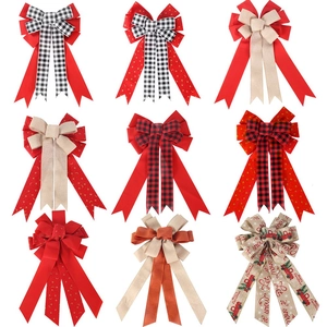 Macro view of Christmas decorative bows set featuring plaid ribbon and holiday festive prints