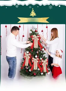 Family decorating a Christmas tree with large rustic burlap and red gold glitter bows