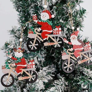 Set of 3 wooden Christmas tree ornaments featuring Santa, Snowman and Reindeer on bicycles