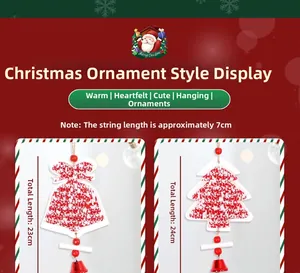 Close-up of knitted red Christmas tree and bell ornaments with wooden beads and bells