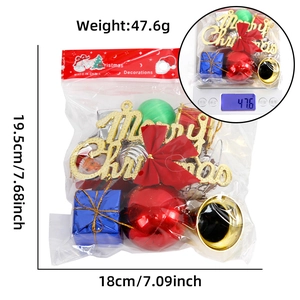 Detail showing assorted Christmas ornaments with red balls and golden bells in package