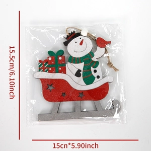 Christmas snowman on red wooden sleigh hanging ornament with gift boxes and star cutouts