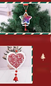 Close-up of wooden Christmas star with sequins and knitted heart pendant with bells
