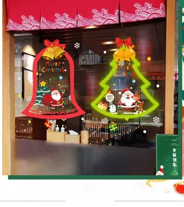 Detail of Santa and reindeer electrostatic Christmas window stickers on shop glass door