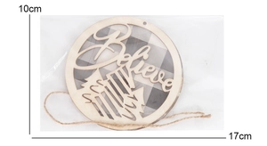 Detail of wooden Believe Christmas ornament with snowflake cutout and buffalo plaid background