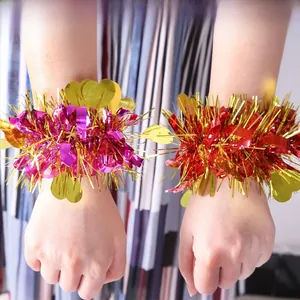 Close-up of sparkling sequin heart slap bracelets in purple, gold and red colors