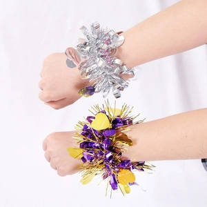 Sparkly sequin pom-pom wristbands for cheerleading in silver and purple-gold colors