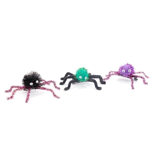 Detailed view of Halloween plush spider hair clips with glitter legs and moving plastic eyes