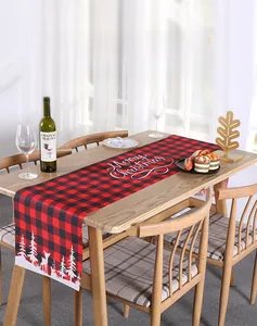Close-up of red and black buffalo plaid Christmas table runner with reindeer print