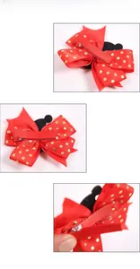 Détail de la pince à cheveux noeud rouge à pois avec oreilles de souris et clip en métal argenté