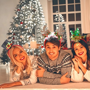 Three festive Christmas headbands featuring reindeer antlers and holiday trees for party fun
