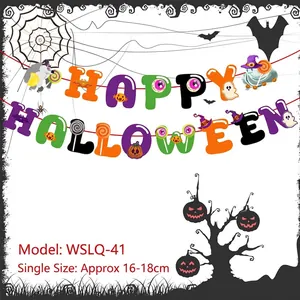 Detail of Happy Halloween banner with paper ghosts bats and spiders on red string