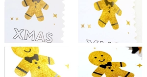 Close-up of glitter gingerbread man and XMAS text on scalloped Christmas paper bunting