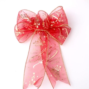 Red sheer organza Christmas bow with golden Merry Christmas print and star patterns