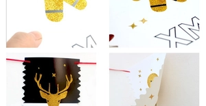 Detail of Christmas banner featuring glittery reindeer, socks, and XMAS lettering