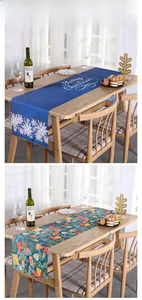 Detail of Christmas table runner with Merry Christmas text and festive holiday patterns