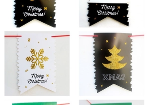 Detail of Merry Christmas bunting with gold glitter patterns and festive snowflake motifs