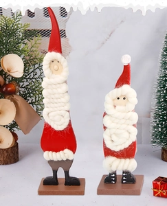 Detail of two-piece Santa Claus wooden ornaments with knitted beards for Christmas table decor