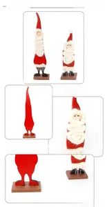 Detail showing two felt Santa Claus figurines with wool beards and wooden stands