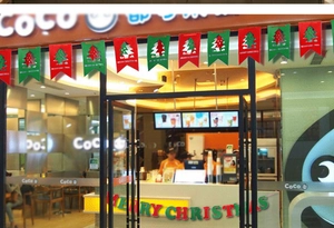Close-up of red and green felt Christmas tree banners with Merry Christmas lettering
