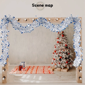 Close-up of sparkling silver tinsel garland with blue star sequins for Christmas decor